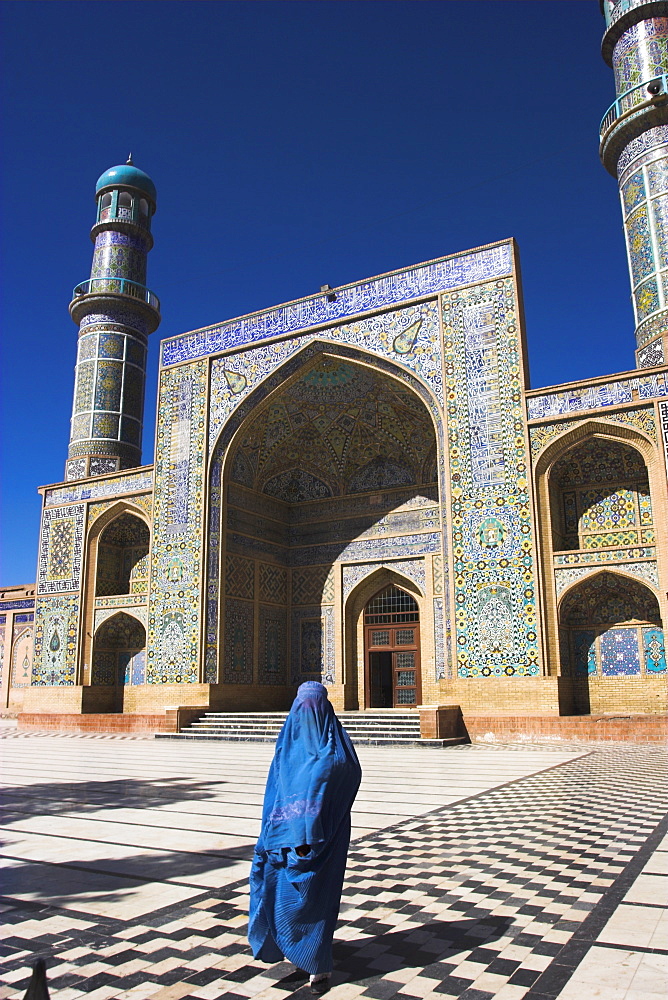 Lady wearing a blue burqua outside the Friday Mosque (Masjet-e Jam), Herat, Afghanistan, Asia