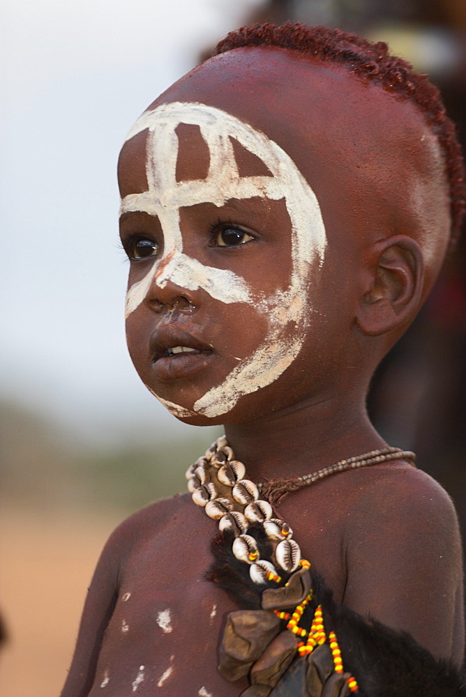 Portrait of a Hamer (Hamar) child at Evangadi dancing (night dance), Dombo Village, Turmi, Lower Omo Valley, Ethiopia, Africa