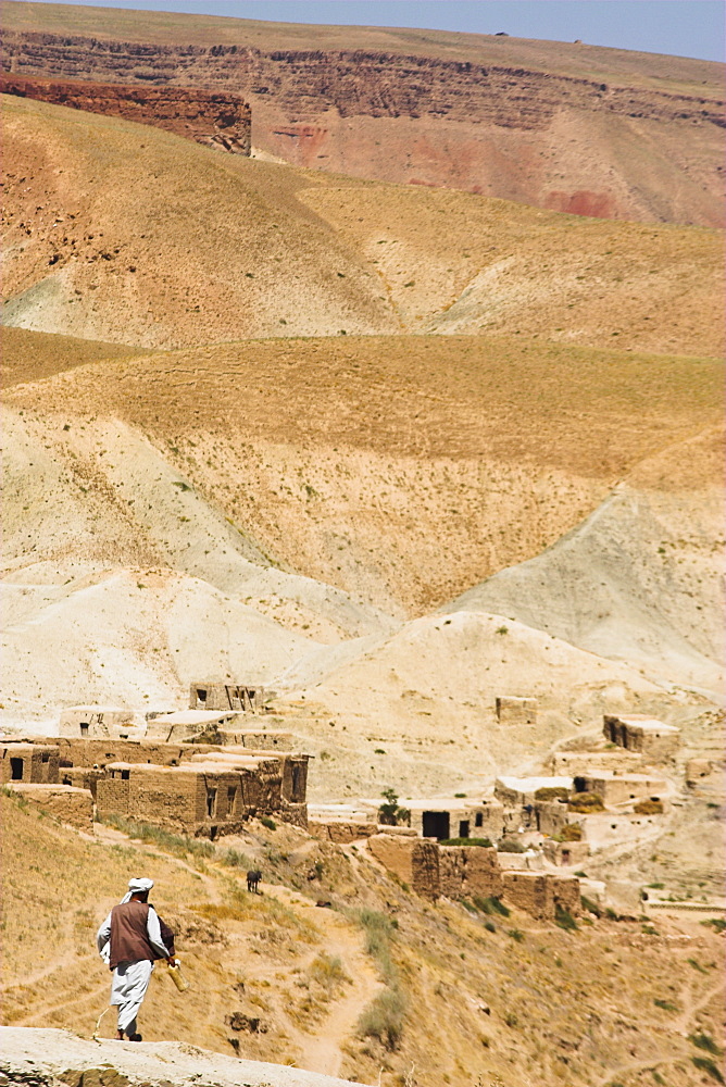 Man walking down mountain road, between Herat and Maimana, after Subzak Pass, Afghanistan, Asia