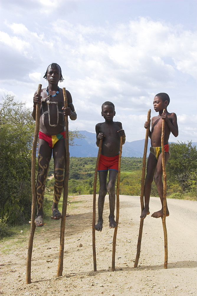 Dorze boys with body painting on stilts, Chencha mountains, Ethiopia, Africa