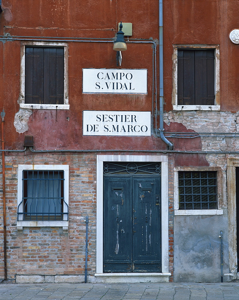 Signs on a house in Venice, Veneto, Italy, Europe