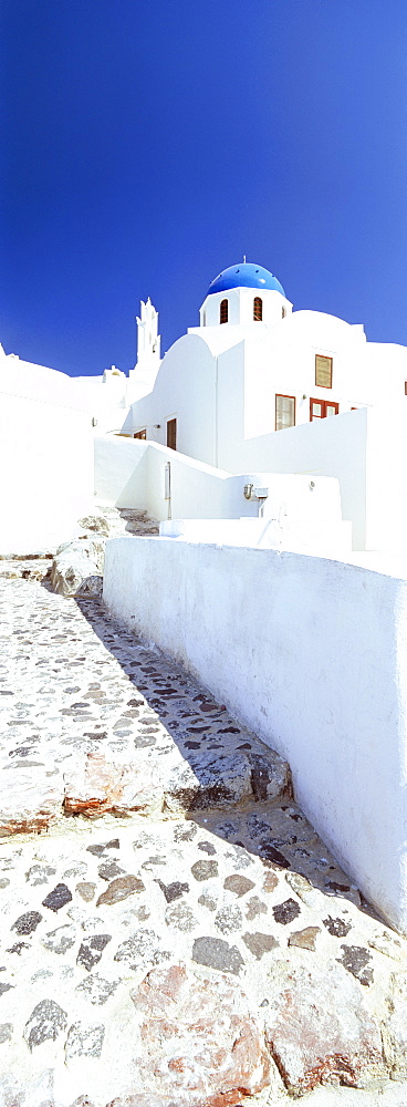 Blue domed church and whitewashed buildings, Oia, Santorini (Thira), Cyclades Islands, Greek Islands, Greece, Europe