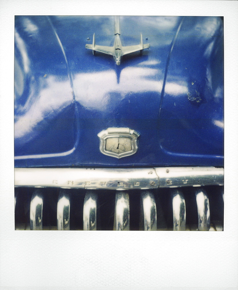 Polaroid of detail of bonnet and chrome grill of blue classic American car, Havana, Cuba, West Indies, Central America