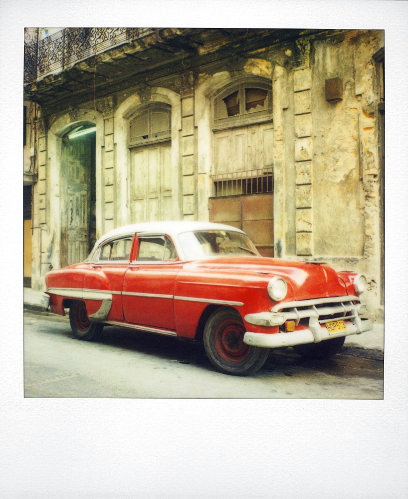 Polaroid of red classic American car parked on street, Havana, Cuba, West Indies, Central America