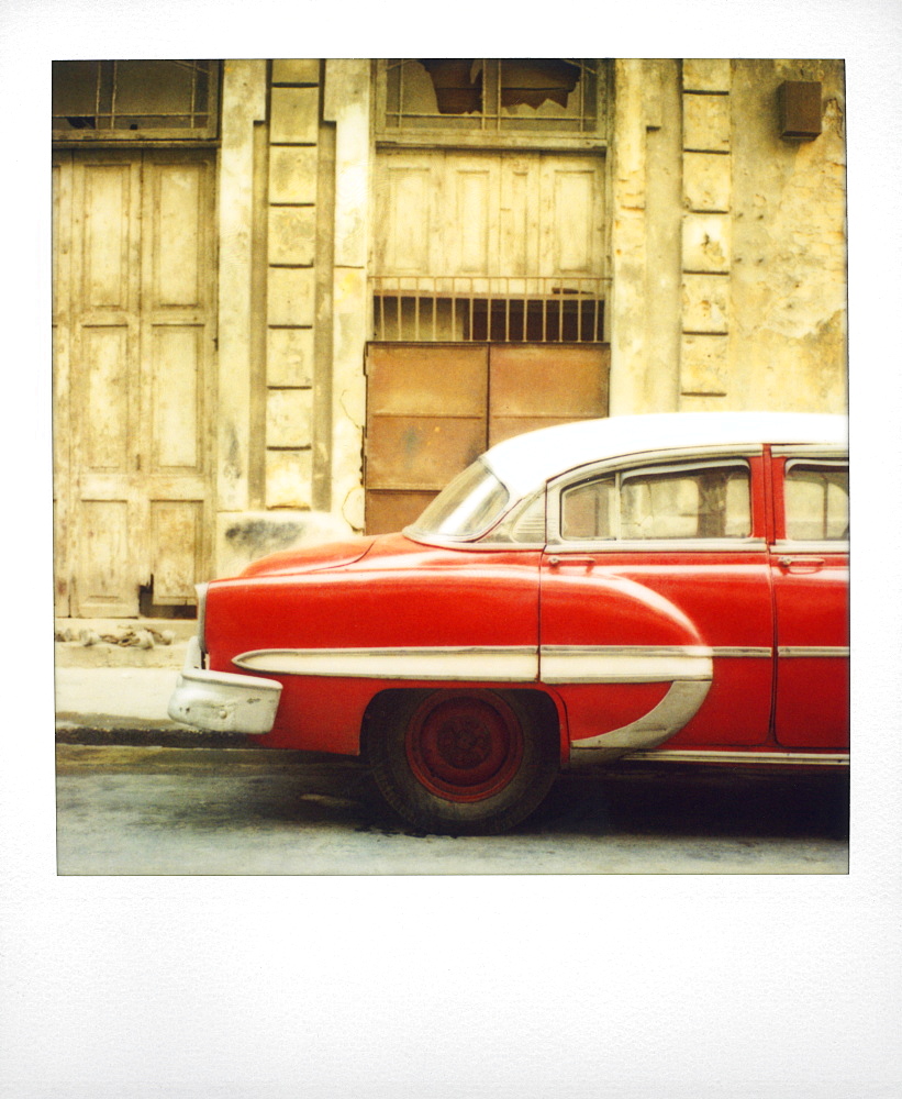 Polaroid of the profile of red classic American car, Havana, Cuba, West Indies, Central America