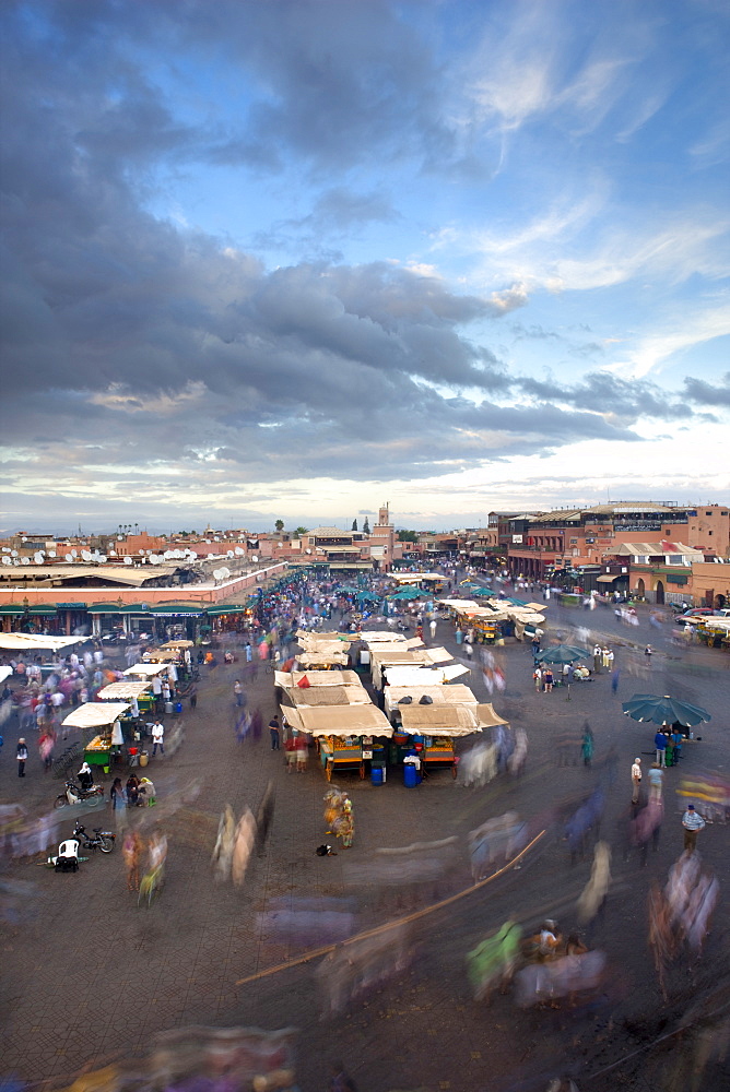 View over Djemaa el Fna at dusk with foodstalls and crowds of people, Marrakech, Morocco, North Africa, Africa