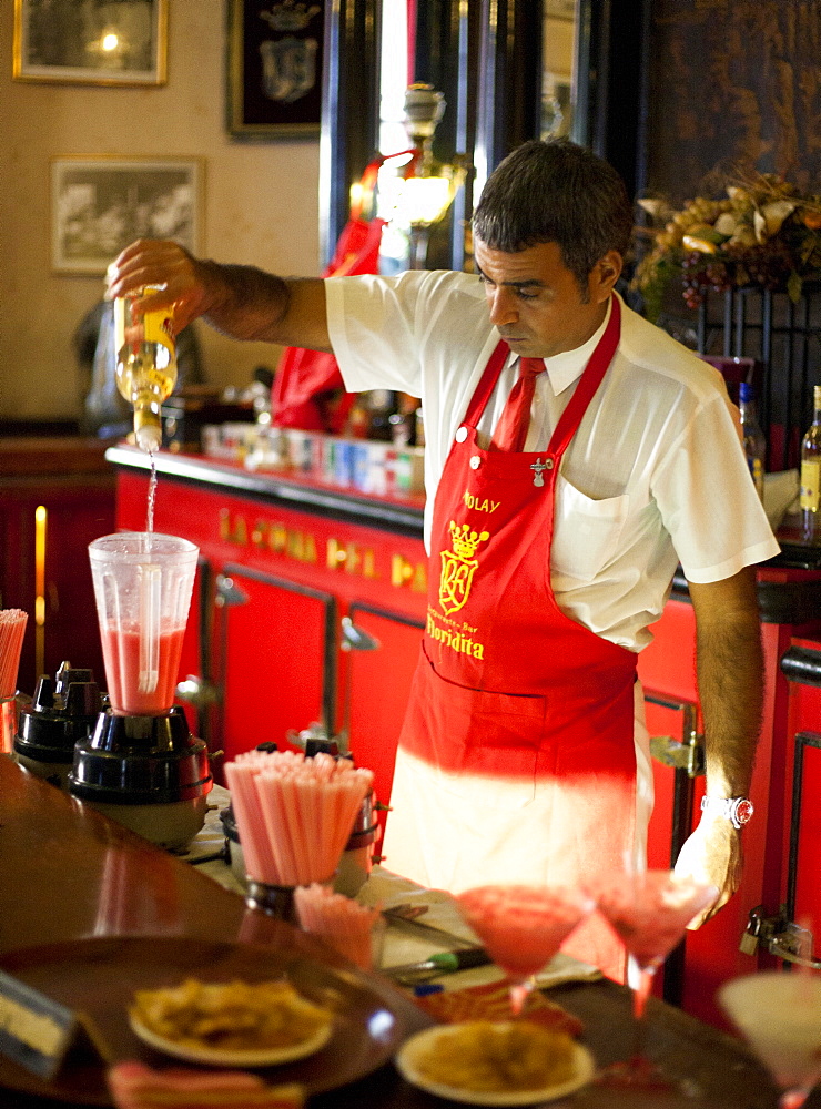 Barman mixing strawberry Daquiris in Bar El Floridita, a favourite drinking spot of late author Ernest Hemingway, Havana, Cuba, West Indies, Central America