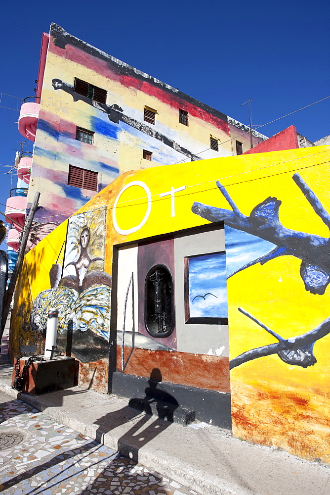 Buildings painted in colourful Afro-Cuban art, masterminded by artist Salvador Gonzalez Escalona, Callejon de Hamel, Havana, Cuba, West Indies, Central America