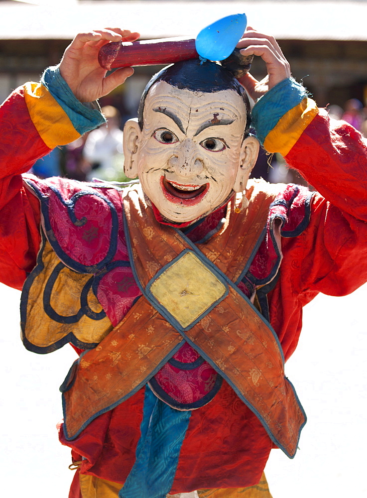 Clown with carved wooden penis on his head entertaining crowds at the Tamshing Phala Choepa Tsechu, near Jakar, Bumthang, Bhutan, Asia