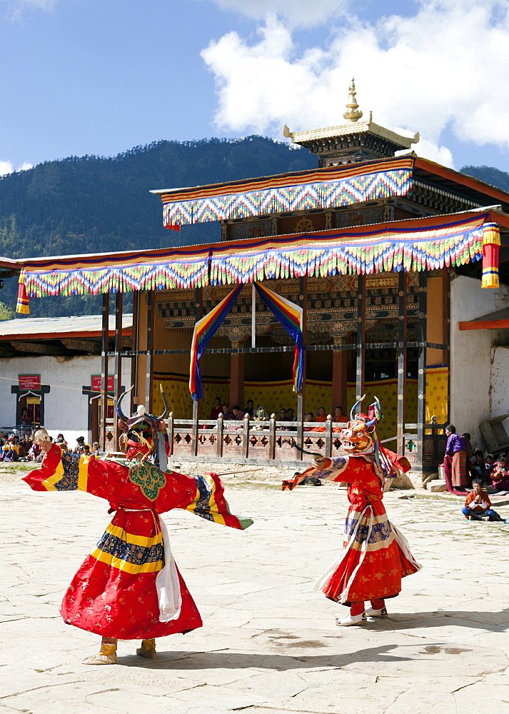 Buddhist monks performing masked dance during the Gangtey Tsechu at Gangte Goemba, Gangte, Phobjikha Valley, Bhutan, Asia