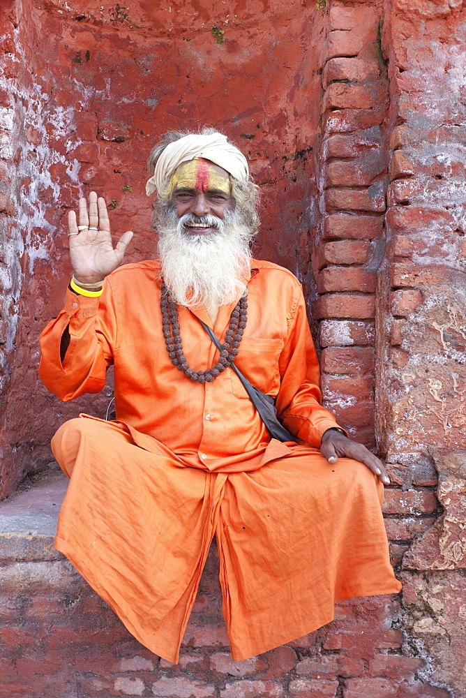 Sadhu (Holy Man) wearing brightly coloured clothing and characteristic facial painting at Pashupatinath Temple, Kathmandu, Nepal, Asia