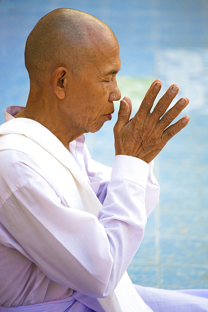 Buddhist monk praying at Botataung Paya (Botataung Pagoda), Yangon (Rangoon), Myanmar (Burma), Asia