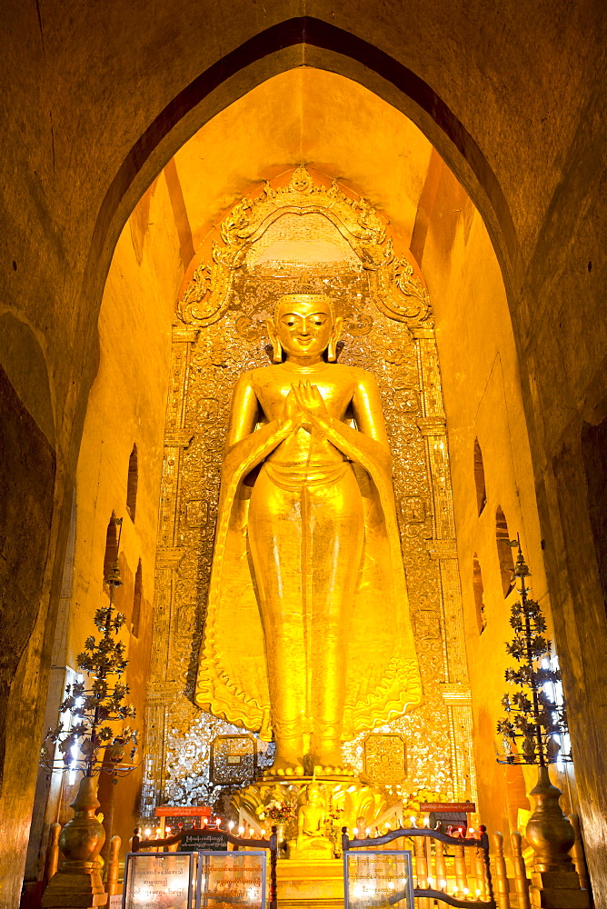 Golden Buddha image standing 33ft tall inside Ananda Paya, Bagan, Myanmar (Burma), Southeast Asia