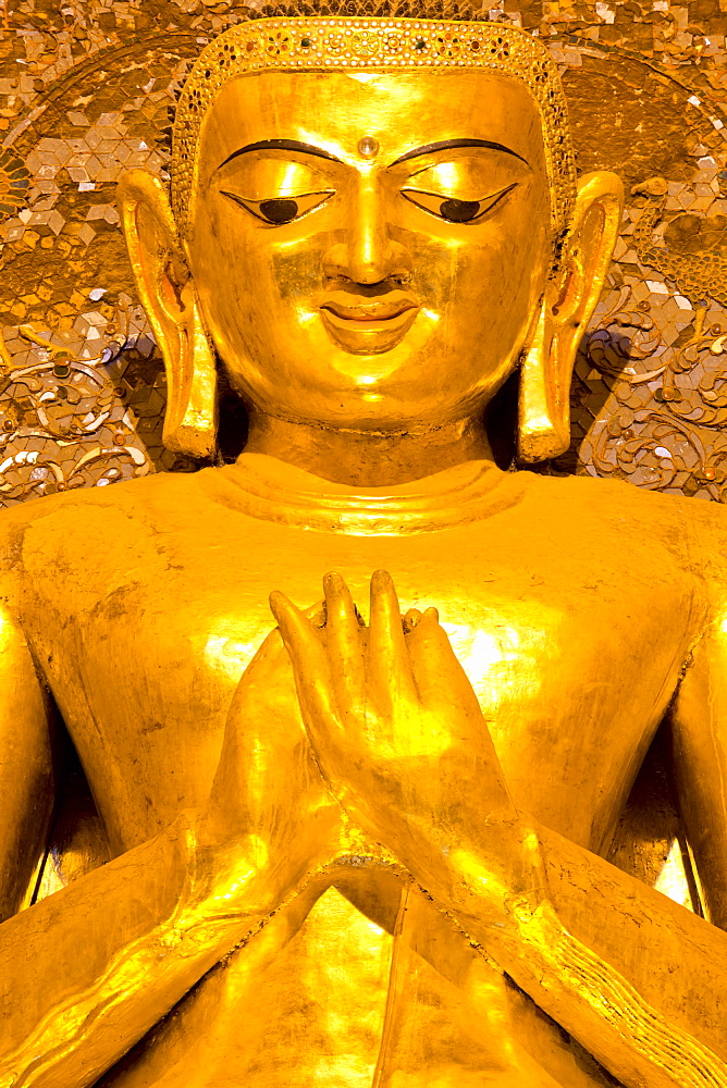 Golden Buddha image standing 33ft tall inside Ananda Paya, Bagan, Myanmar (Burma), Southeast Asia