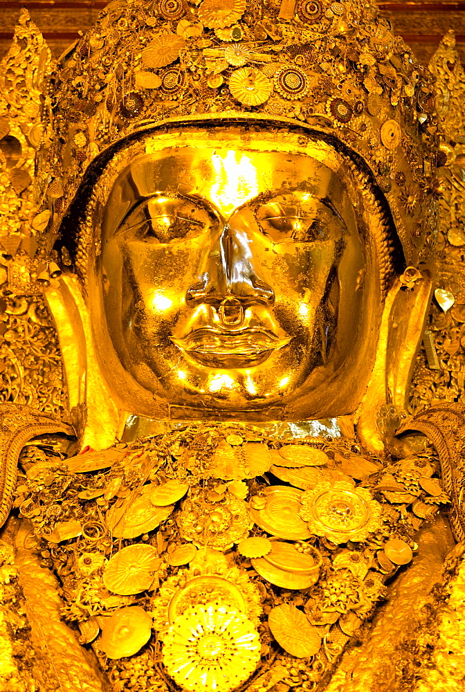 Myanmar's most famous Buddha image, 13ft high and covered in 6 inches of pure gold leaf , Mahamuni Paya, Mandalay, Myanmar (Burma), Southeast Asia