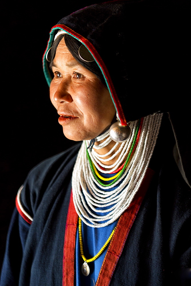 Woman of the Akha tribe in traditional dress, in a hill village near Kengtung (Kyaingtong), Shan State, Myanmar (Burma), Asia