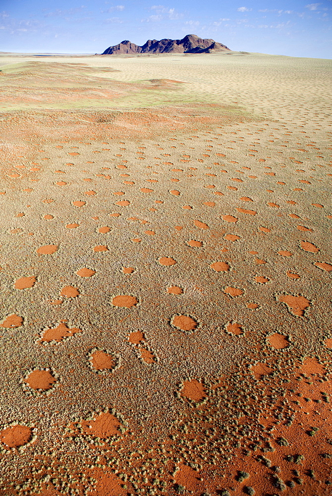 Aerial view from hot air balloon over magnificent desert landscape covered in Fairy Circles, Namib Rand game reserve Namib Naukluft Park, Namibia, Africa