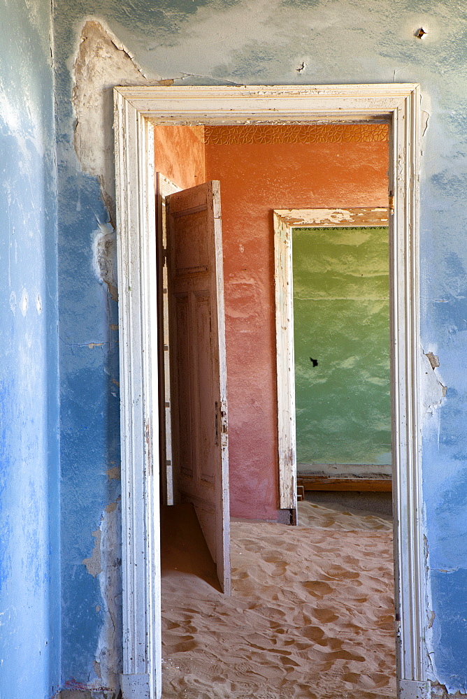 Interior of building slowly being consumed by the sands of the Namib Desert in the abandoned former German diamond mining town of Kolmanskop, Forbidden Diamond Area near Luderitz, Namibia, Africa 