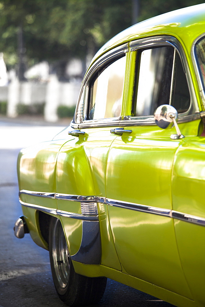 Green vintage American car parked on a street in Havana Centro, Havana, Cuba, West Indies, Central America