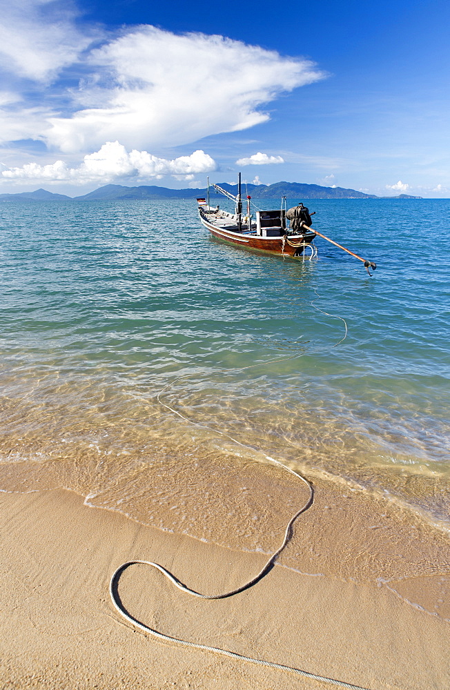 Traditional long-tailed fishing boat moored off Maenam Beach on the North Coast of Koh Samui, Thailand, Southeast Asia, Asia