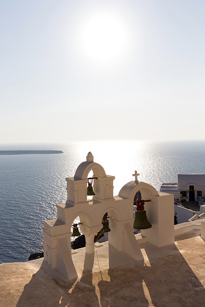 White church belltowers overlooking the Caldera, Oia, Santorini, Cyclades, Greek Islands, Greece, Europe