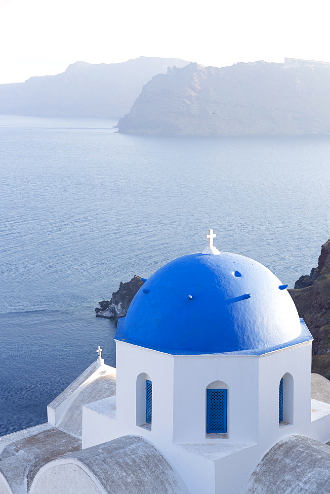 White church with blue dome overlooking the Caldera, Oia, Santorini, Cyclades Islands, Greek Islands, Greece, Europe