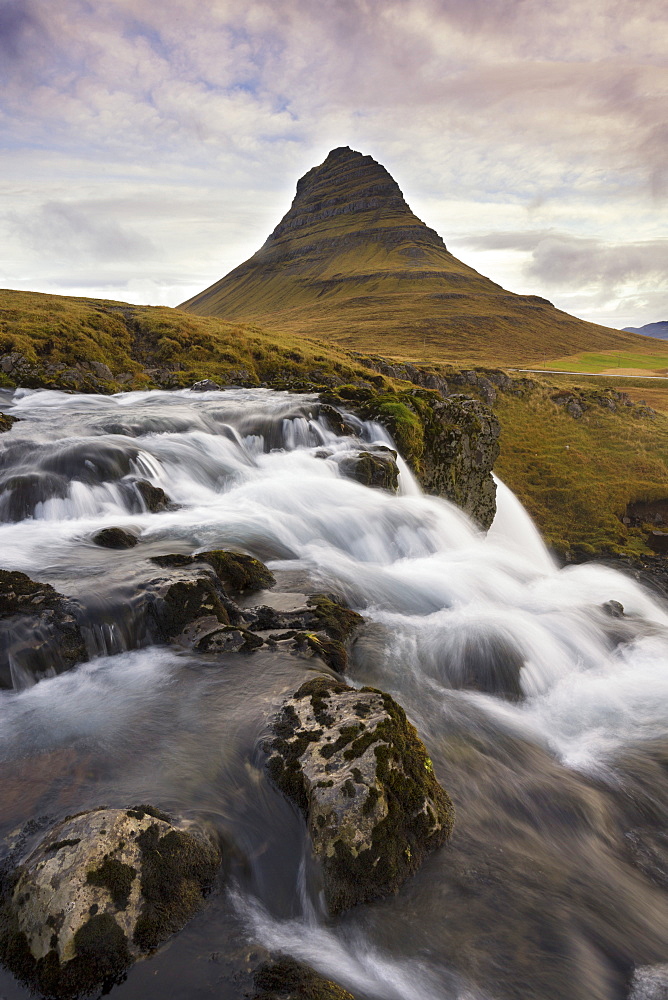 Mountain river with Kirkjufell (Church Mountain) in background, Grundafjordur, Snaefellsnes Peninsula, Iceland, Polar Regions