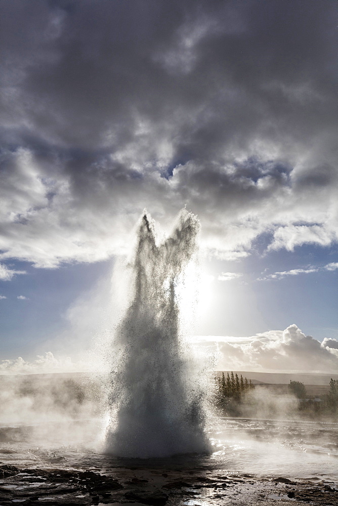 Strokkur Geysir erupting against stormy sky, Geysir, South West Iceland, Polar Regions