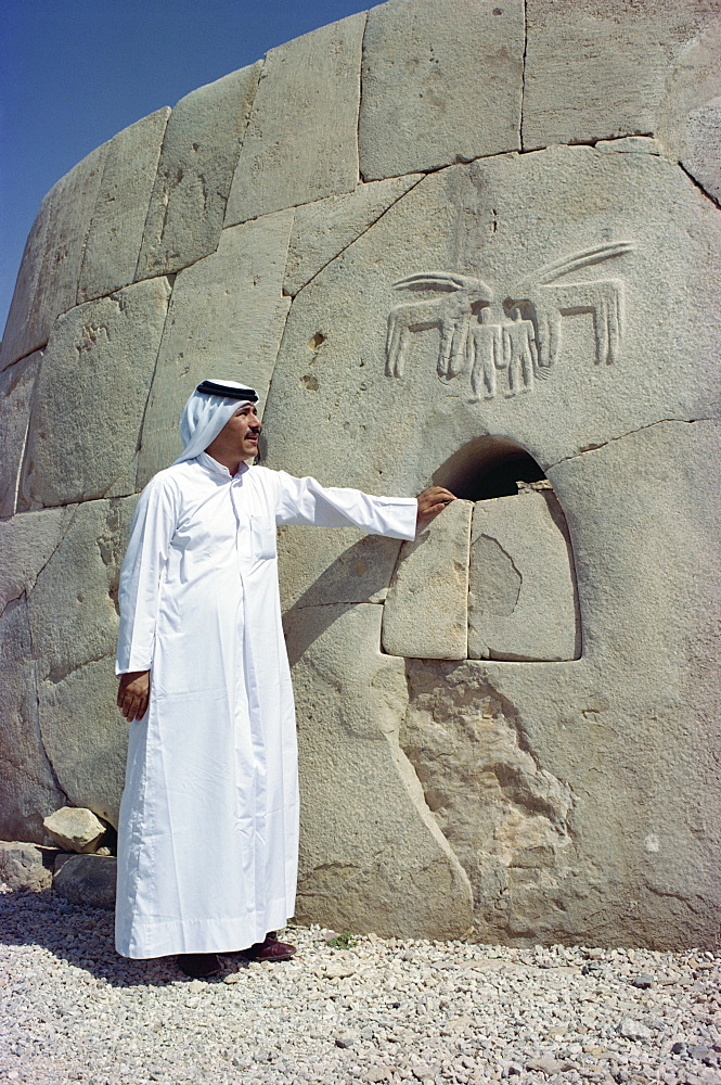 Portrait of a man in traditional dress at the Umm al Nar Tomb dating from around 2500 BC, Al Ain, near Abu Dhabi, U.A.E., Middle East