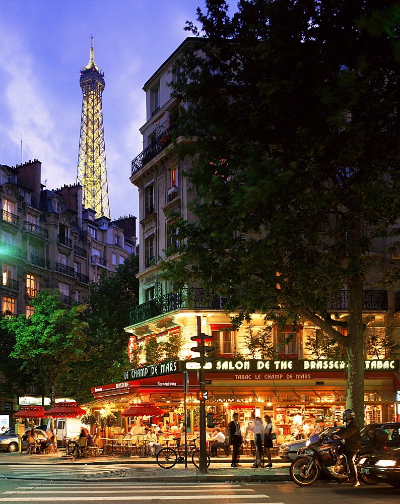 Eiffel Tower illuminated, above a Paris street, Paris, France, Europe