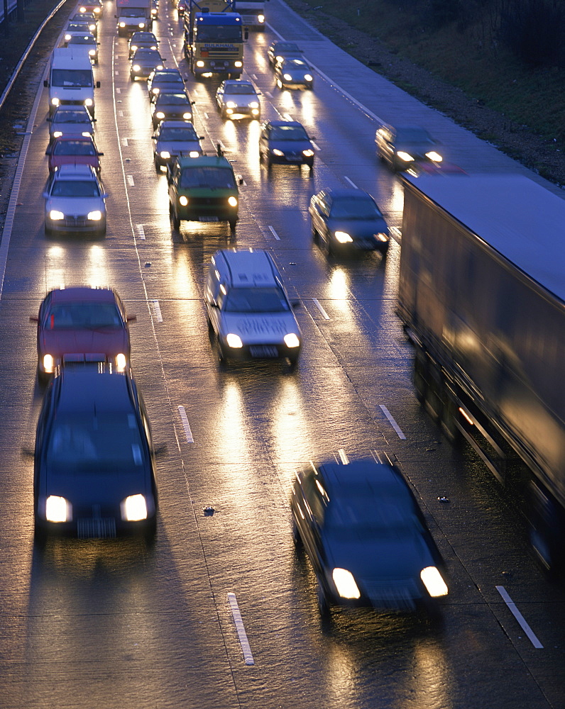 Traffic on wet motorway at dusk, United Kingdom, Europe