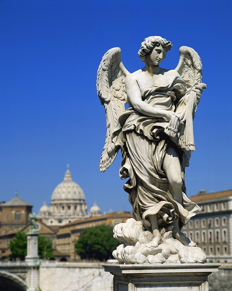 Statue of an angel in front of the dome of St. Peters in Rome, Lazio, Italy, Europe