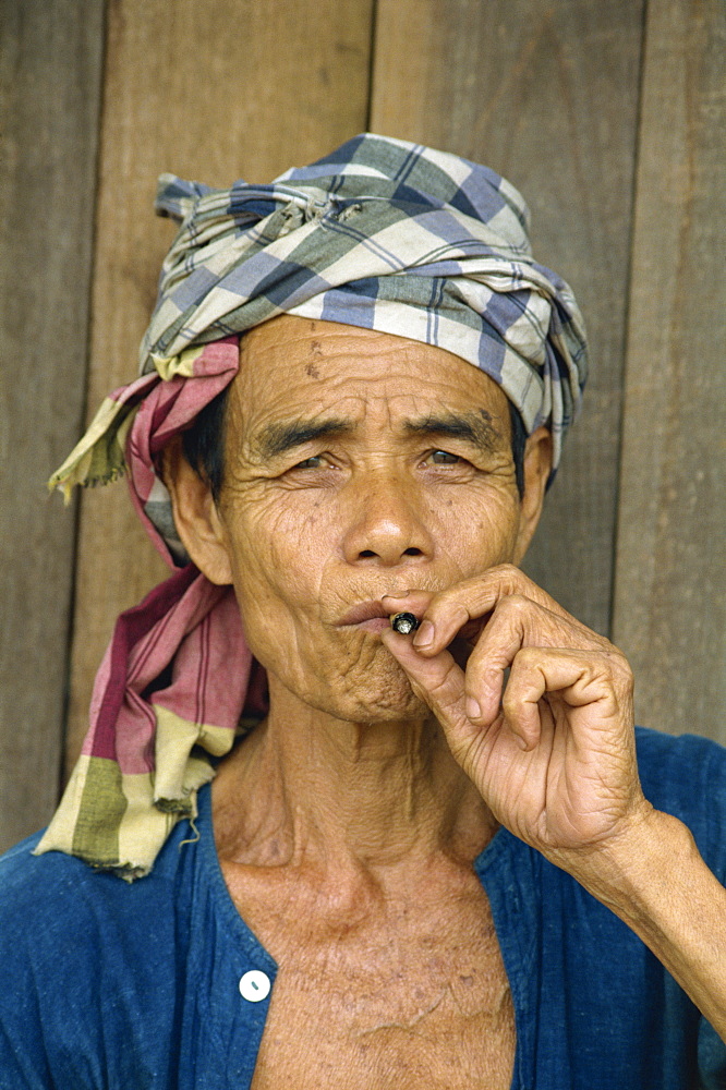 Portrait of refugee smoking, Shan Man Refugee Camp, Tak Maesot, Thailand, Southeast Asia, Asia