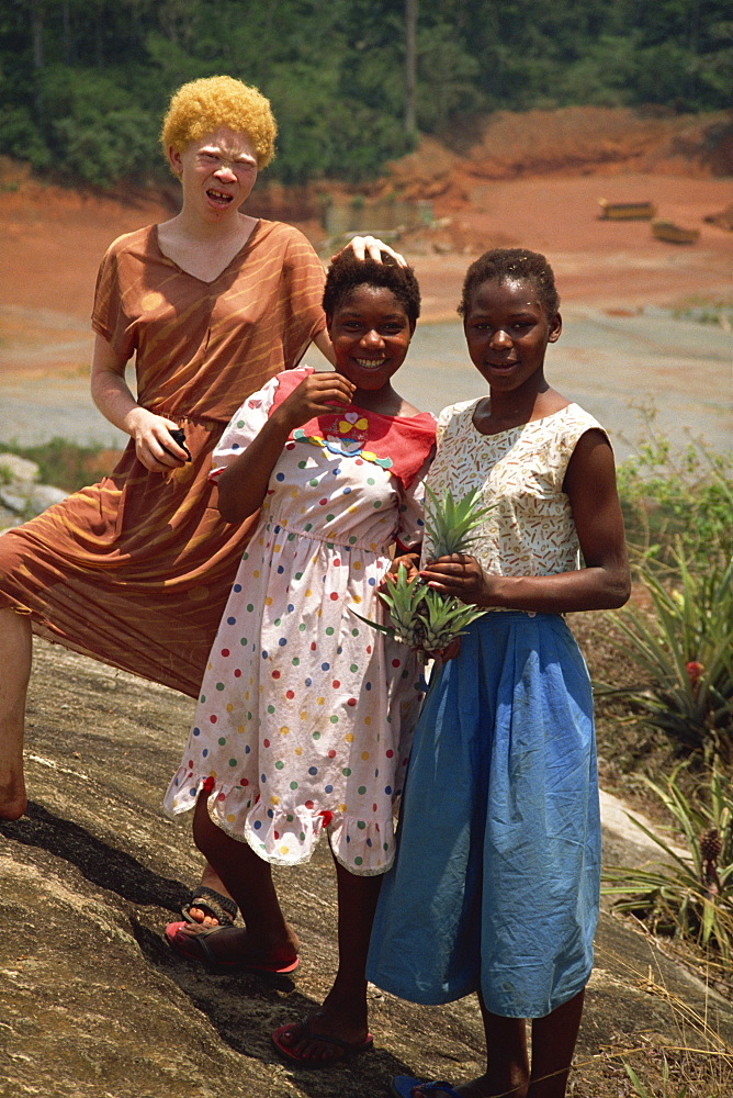 Three local girls, including albino girl, Sangmelima, Cameroon, West Africa, Africa