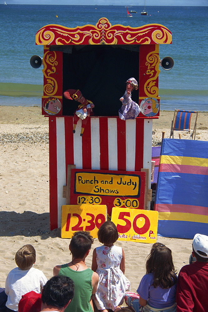 Punch & Judy show on the beach at Swanage, Dorset, England, United Kingdom, Europe