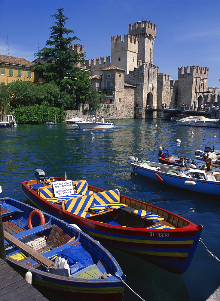 Moored boats in the harbour at Sirmione on Lake Garda, Lombardia, Italy, Europe