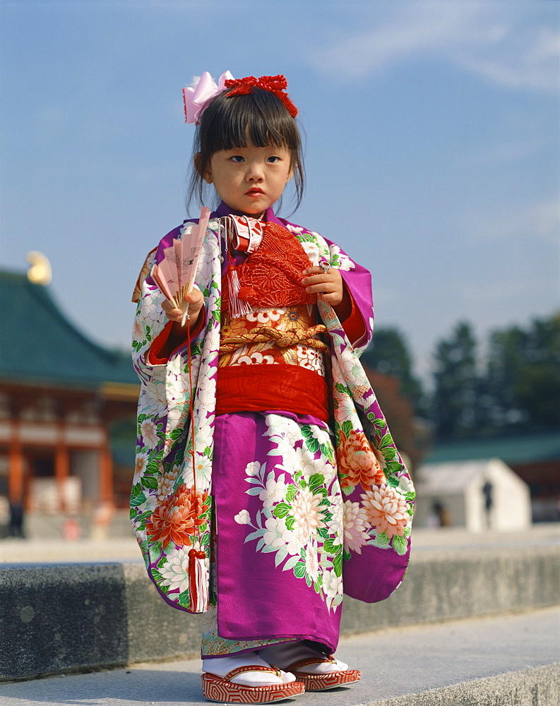 Portrait of a little girl in traditional dress, in Kyoto, Japan, Asia