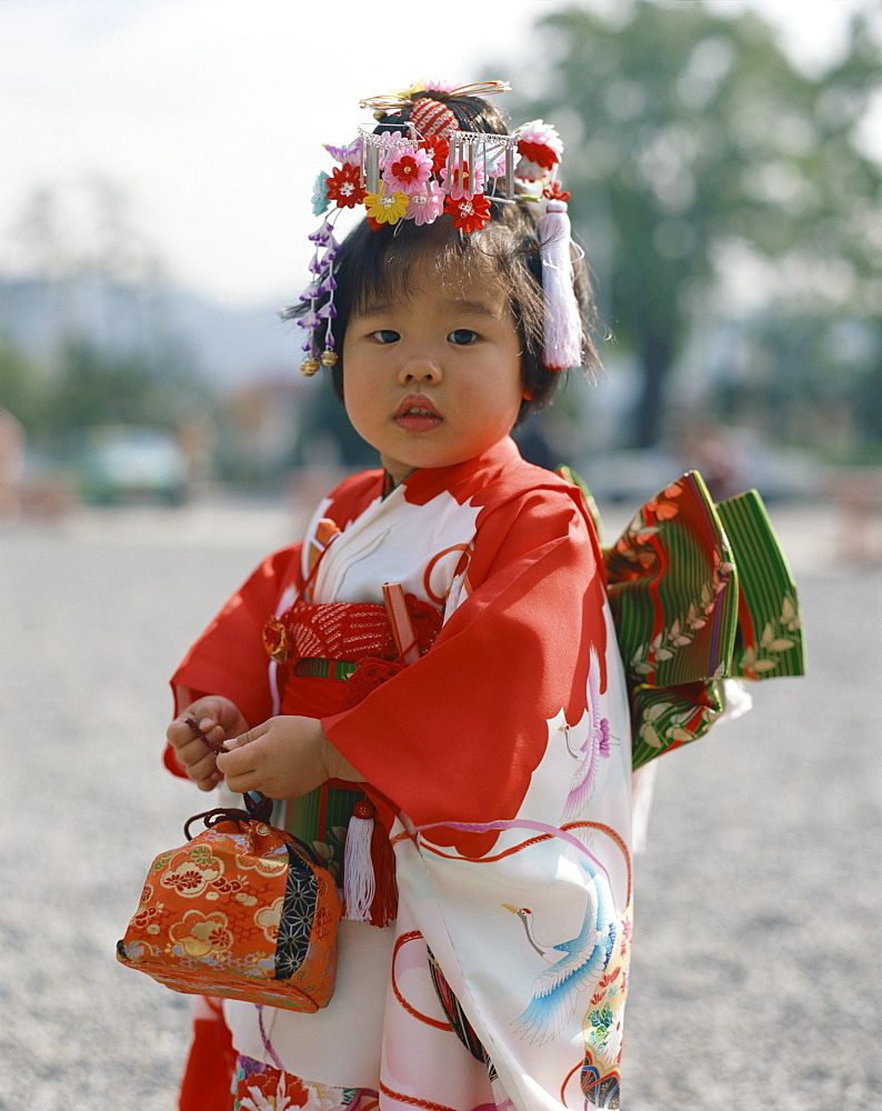 Portrait of a little girl in traditional dress, in Kyoto, Japan, Asia