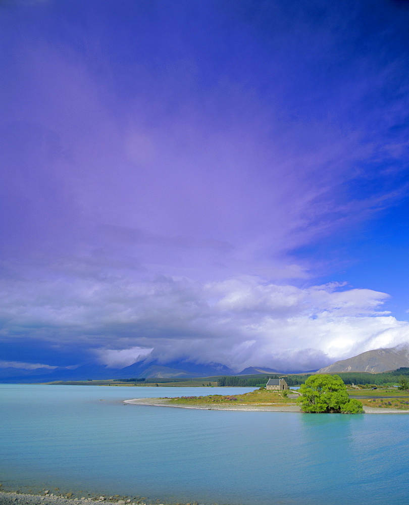 Storm approaching over Two Thumb Range, the Church of the Good Shepherd on the shore of Lake Tekapo, Canterbury District, South Island, New Zealand