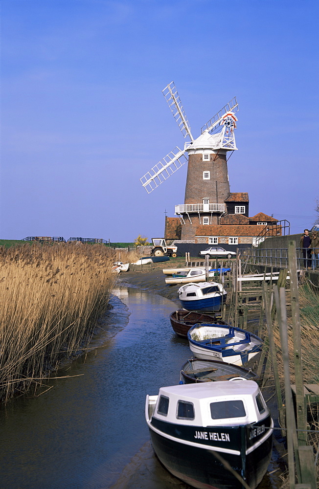 Boats on waterway and windmill, Cley next the Sea, Norfolk, England, United Kingdom, Europe