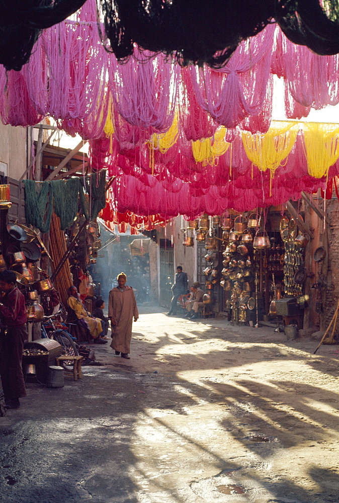 Figure in wool dyers textile souk, Marrakesh, Morocco, Africa 