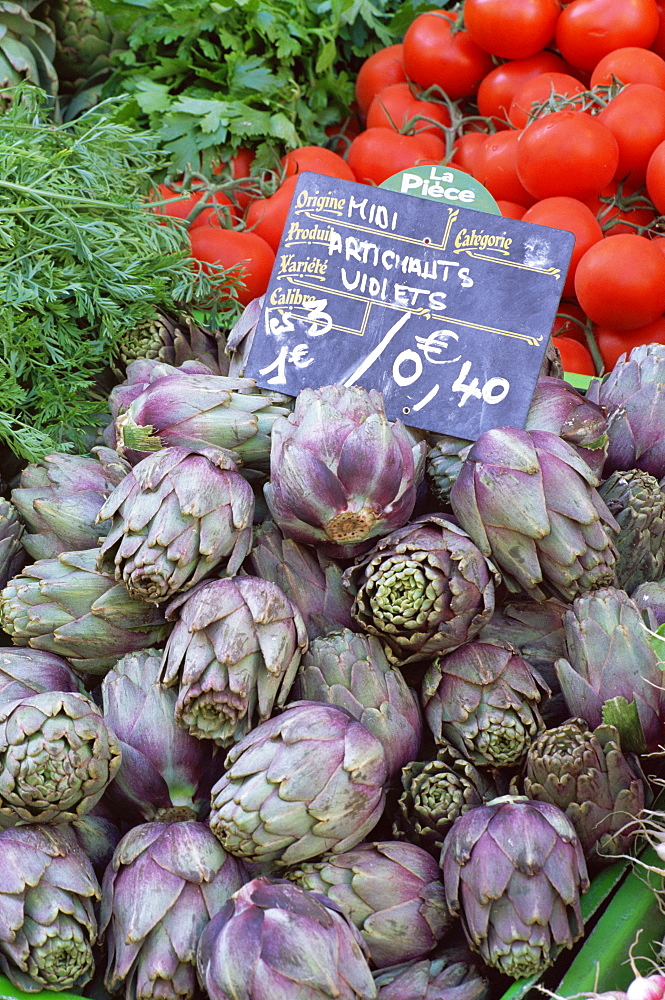 Artichokes for sale on market in the Rue Ste. Claire, Annecy, Haute Savoie, Rhone-Alpes, France, Europe