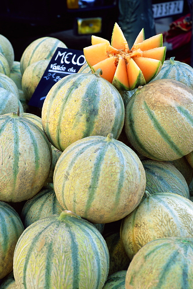 Melons for sale on market in the Rue Ste. Claire, Annecy, Haute-Savoie, Rhone-Alpes, France, Europe