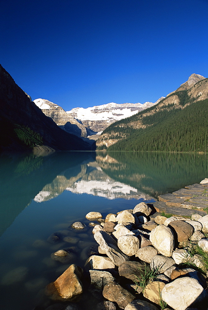 View to Mount Victoria across the emerald waters of Lake Louise, in summer, Banff National Park, UNESCO World Heritage Site, Alberta, Canada, North America