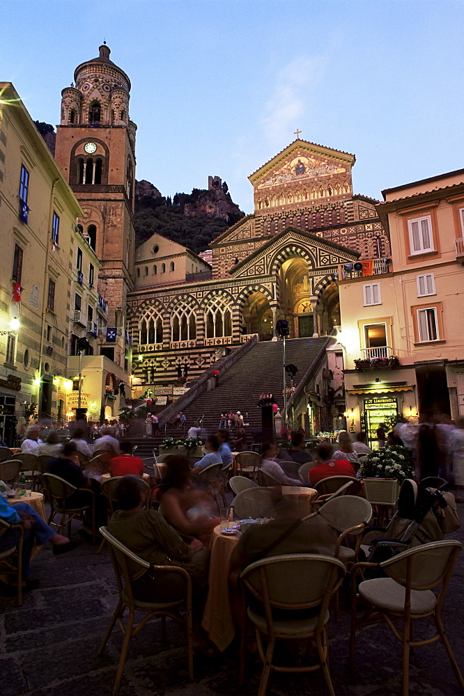 Busy pavement cafe at dusk, with the cathedral beyond, Amalfi, Costiera Amalfitana, UNESCO World Heritage Site, Campania, Italy, Europe