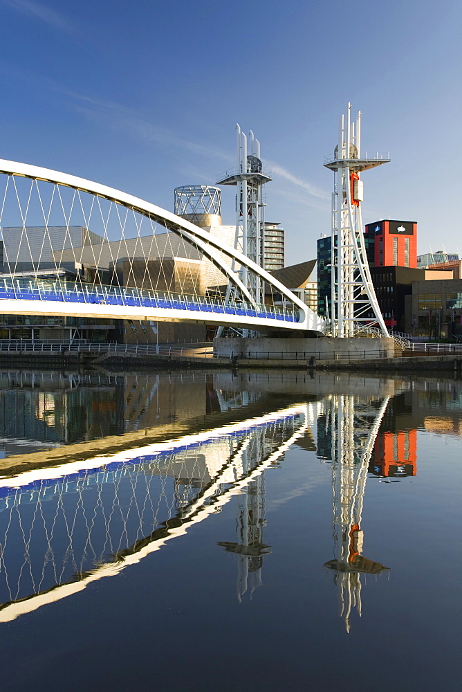 The Millennium Bridge reflected in the Manchester Ship Canal, Salford Quays, Salford, Greater Manchester, England, United Kingdom, Europe