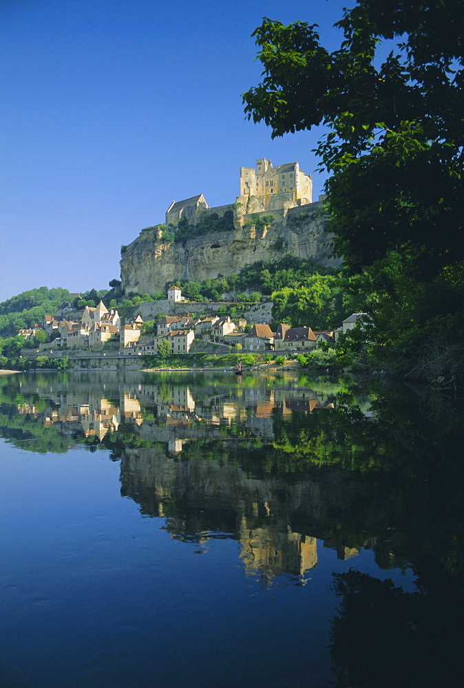 Village and castle reflected in the River Dordogne at Beynac, Dordogne, Aquitaine, France, Europe