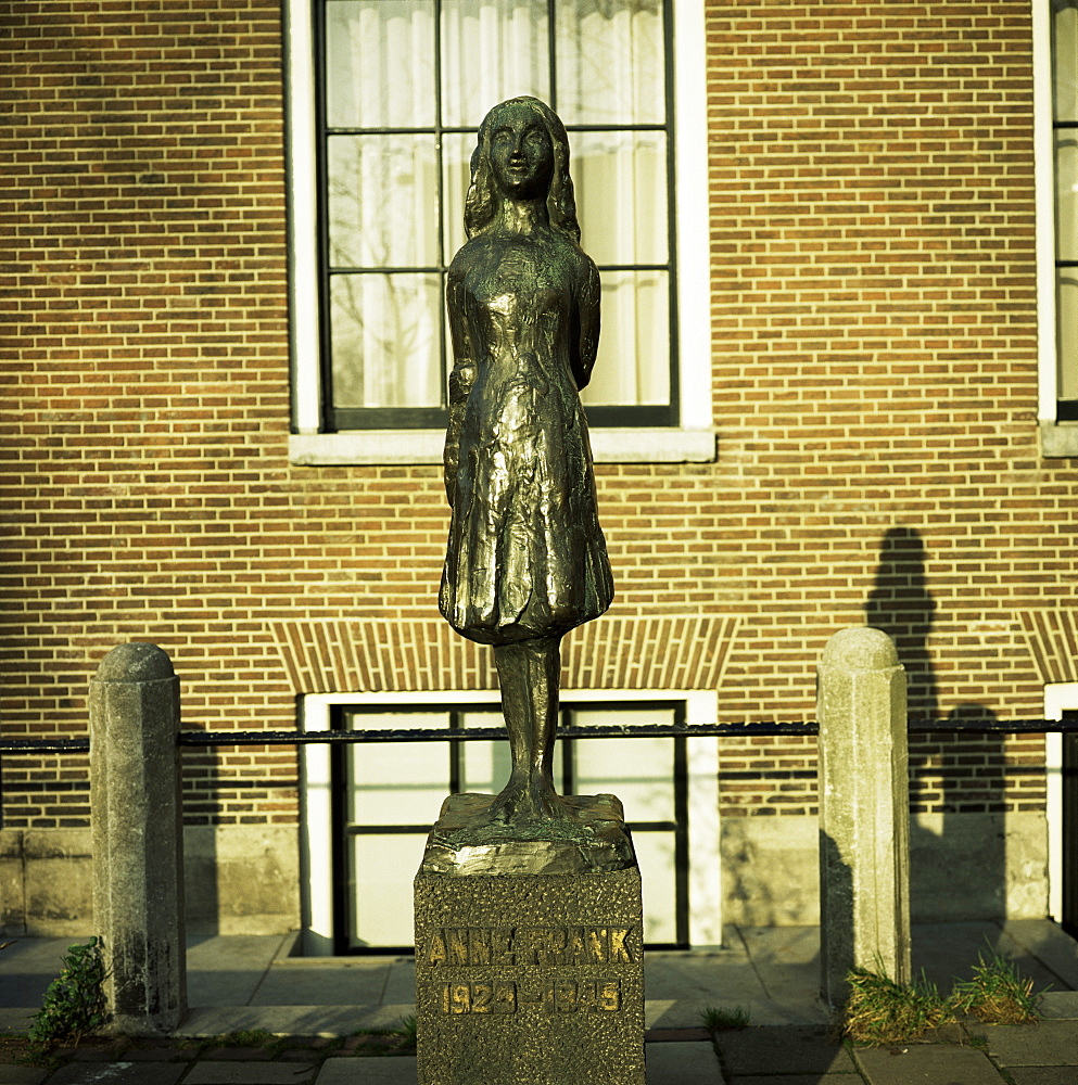 Statue of Anne Frank, the Jewish girl who wrote a diary whilst hiding from the Nazis during World War II, Amsterdam, Holland, Europe