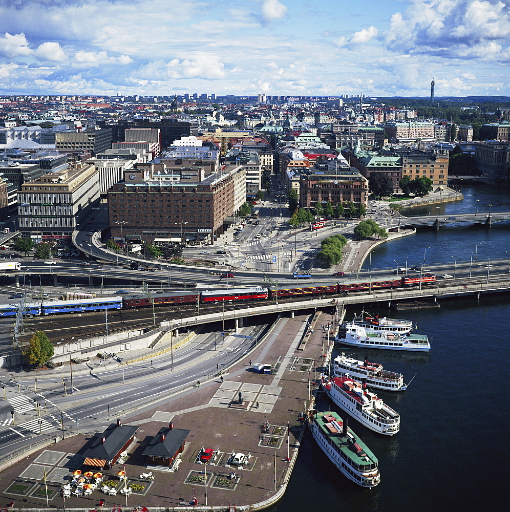 Norrmalm waterfront with cruise boats, railway and the Sheraton Hotel, Stockholm, Sweden, Scandinavia, Europe