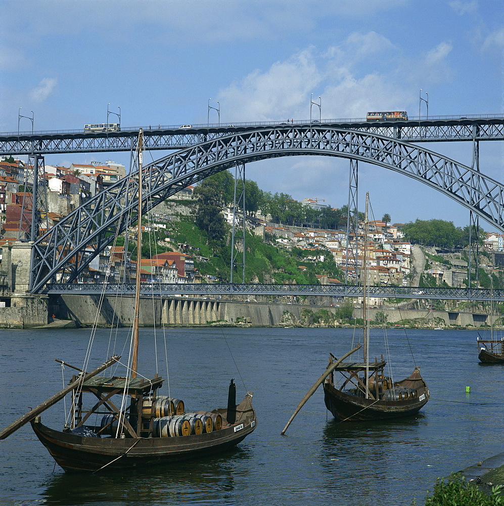 Barco rabelo, the port barges on the River Douro, with the Dom Luis I bridge behind in the city of Oporto, Portugal, Europe